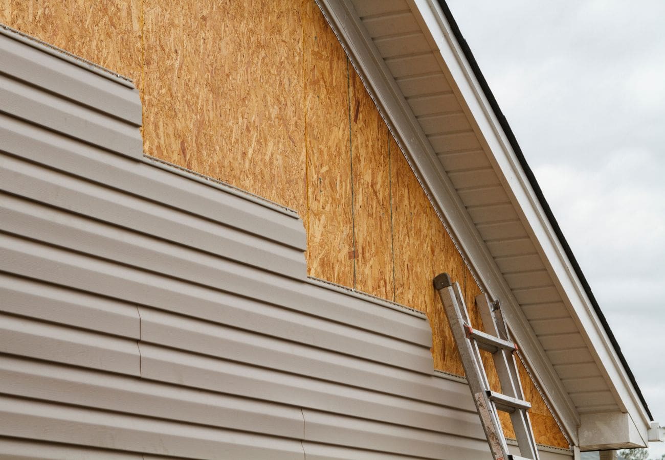 Installing vinyl siding onto a residential home